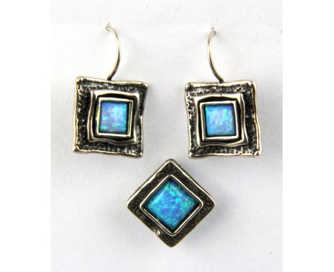 A 925 silver synthetic opal set pendant and similar pair of earrings.