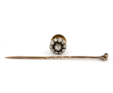 A boxed antique rose metal (tested 18ct gold) stick pin set with a diamond cluster, removable to be set on an 18ct gold tie c