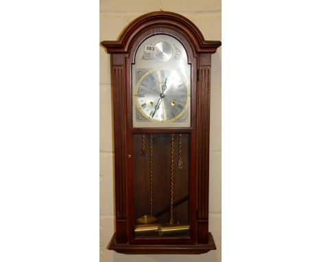 A contemporary wall clock, H. 78cm.