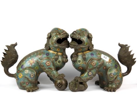 A pair of Chinese cloisonne enamel on bronze lion dog figures, H. 27cm.