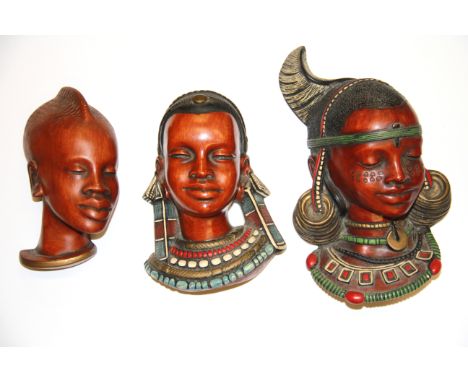 Three 1950's /60's Achatit African head ceramic wall plaques, largest 23cm.