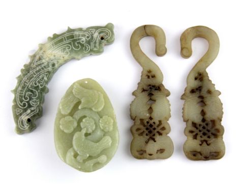 A group of four old Chinese carved nephrite jade items, hook L. 10cm.