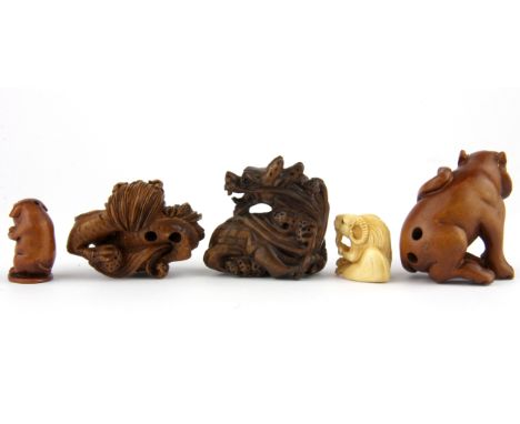 Three carved fruitwood netsuke and two ojime.