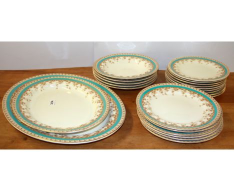 An early 20th century Royal Worcester part dinner service comprising two meat plates, five soup bowls, nine dessert plates an