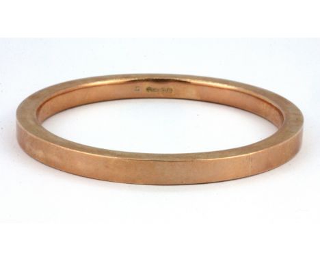 A 9ct rose gold bangle, Dia. 7cm, W. 20.4g.&nbsp;