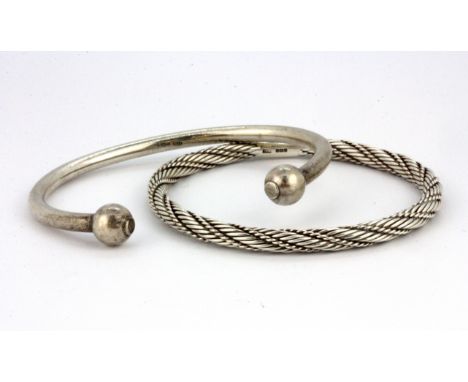 A 925 silver bangle and a 925 silver torque bangle.