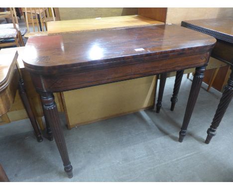 A Regency inlaid mahogany D-shaped fold over card table 