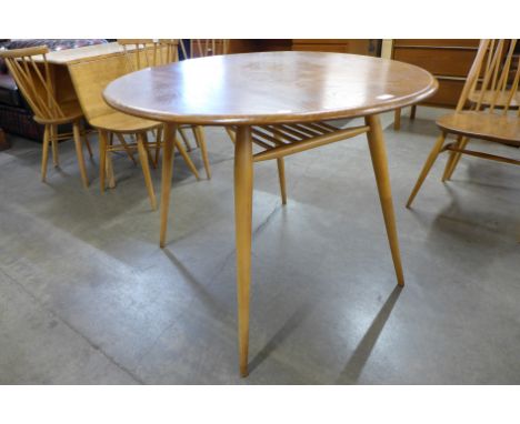 An Ercol Blonde elm and beech oval Windsor breakfast table 