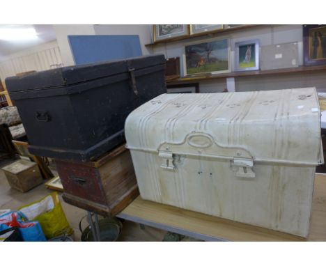 A metal steamer trunk and two pine tool boxes 