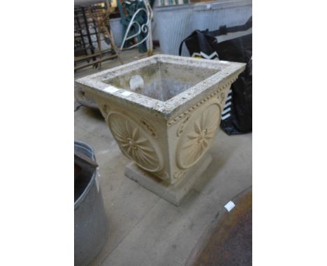 A square concrete garden planter 