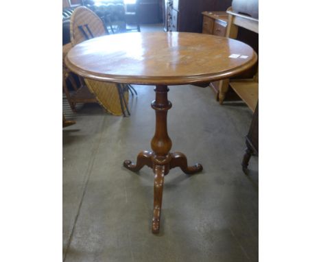 A Victorian walnut circular tilt-top tripod occasional table 