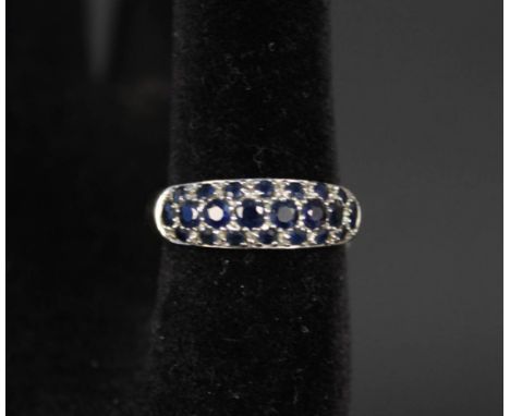 A 9ct gold ring set with multiple blue stones, size V