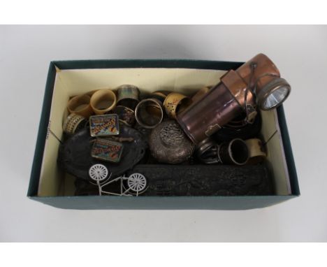 A set of Japanese serviette rings in soft metal box, a copper Ceag Miners Supply Co electric lamp plus other items