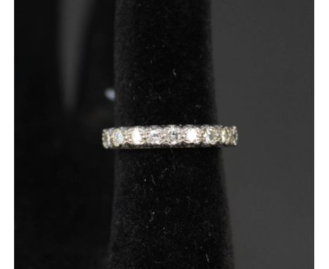 An 18ct gold ring set with nine diamonds, size P