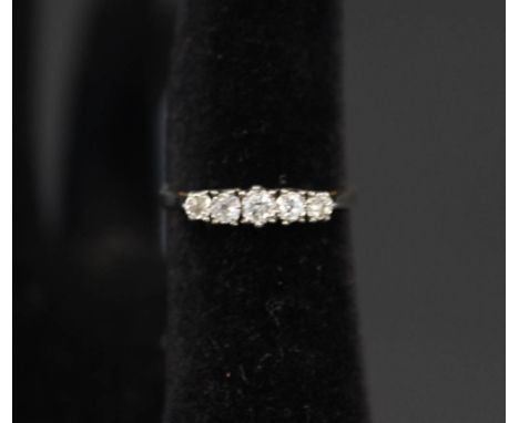 An 18ct gold five stone diamond ring, size N