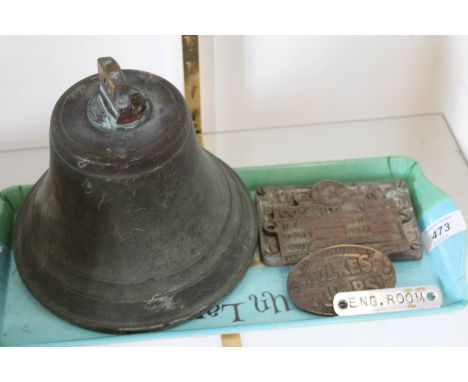 A brass ships bell plus various engine plates