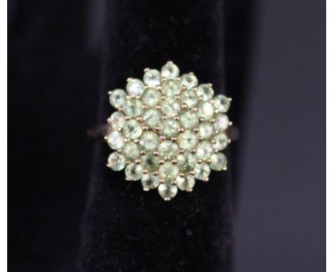 A 9ct gold green stone set cluster ring, size T