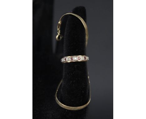 A 9ct gold eternity ring set with garnets and white stones plus a small 9ct gold bracelet