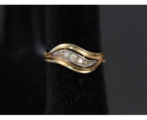 An 18ct gold five stone diamond ring in 'wave' style setting, size O