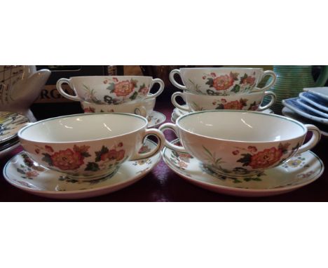 A set of six Wedgwood Eastern Flowers soup bowls and saucers