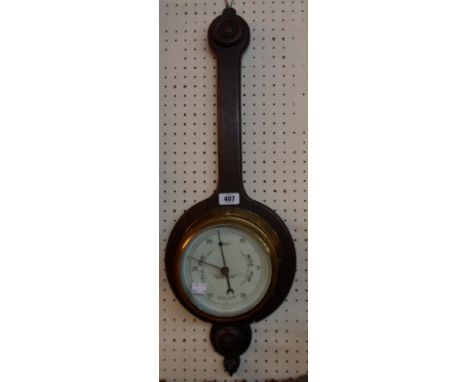 A 7 1/2" diameter brass cased bulkhead "Sestral" aneroid barometer, marked for Henry Browne &amp; Son, Ltd., set on a polishe