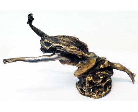 A vintage brass car mascot in the form of a nymph holding an olive branch, with remains of silvered finish