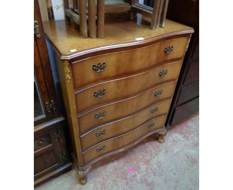 A 30" reproduction mahogany serpentine front chest of five long drawers, set on acanthus cabriole legs with pad feet