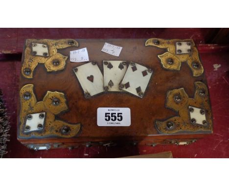 An early 20th Century playing card box with applied decoration