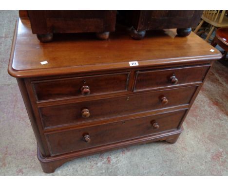 A 3' 3" Victorian mahogany chest of two short and two long graduated drawers, set on bracket feet - bearing paper label for R