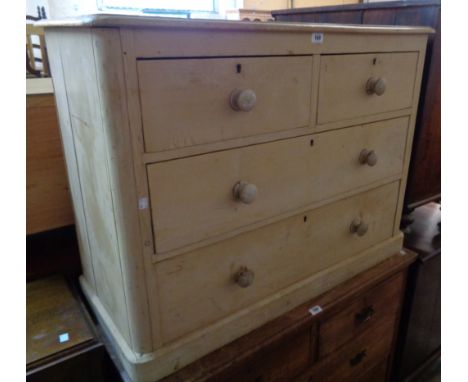 A 3' 5" 19th Century stripped pine chest of two short and two long graduated drawers, set on rounded plinth base