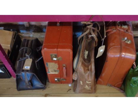 A steamer trunk, Gladstone bag and two suitcases