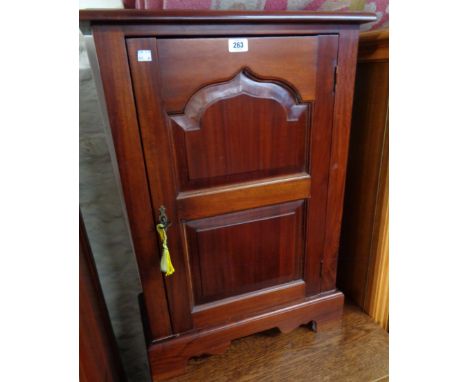 A 22 1/2" Eastern stained hardwood cabinet in the antique style with CD rack and shelf fitted interior, set on bracket feet