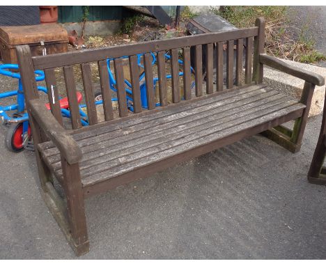A slatted wood garden bench - length 5' 10"