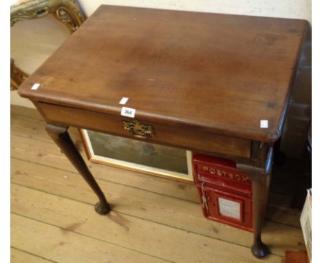 A 30" late Georgian mahogany side table with frieze drawer, set on cabriole legs with pad feet and roller casters