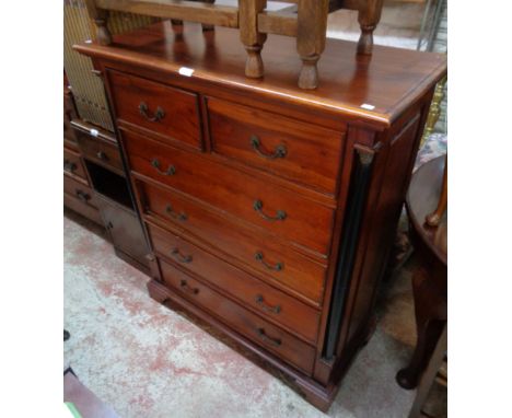 A 3' 3 1/2" Eastern polished hardwood chest in the Regency style, with flanking ebonised columns, two short and four long dra