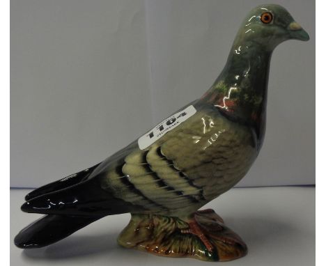 A late 1950's Beswick first type blue pigeon with three stripes to wings and ring to left leg, 1383/1a