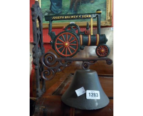 A modern cast iron porch bell with traction engine pattern bracket