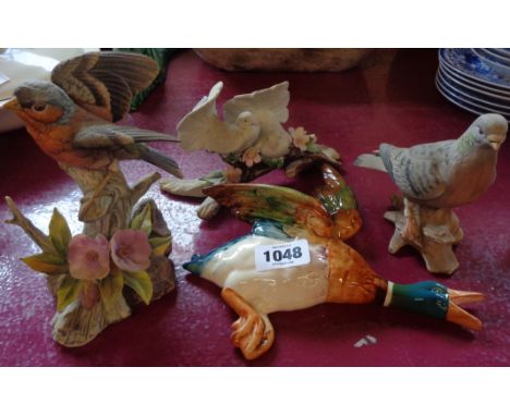 A Beswick flying duck - sold with three further ceramic bird figures