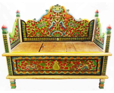 A 3' 9" Indian polychrome painted and profusely carved locker bench with decorative back rail, finials and panelled sides, se