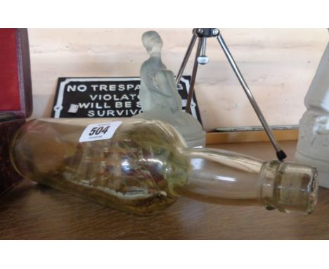 An old ship in a bottle with fishing boat and steam tug before a fishing village - sold with a frosted glass trinket box with
