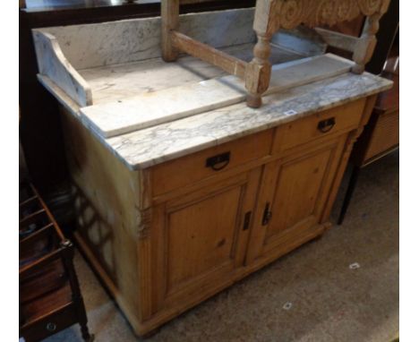 A 3' 3 1/2" late 19th Century stripped pine washstand with marble splashback and top, two short drawers and pair of panelled 