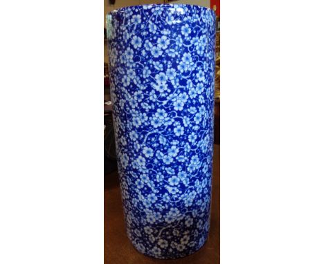 A blue and white stick stand