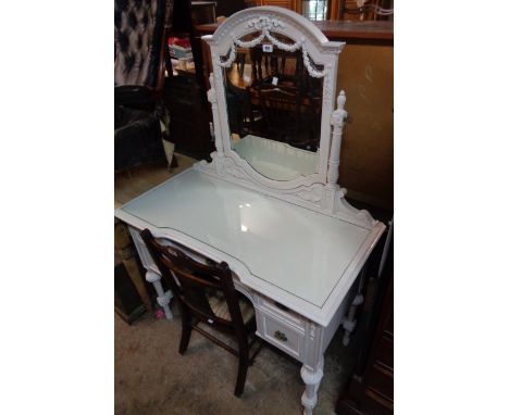 A 3' 5" early 20th Century later painted wood dressing table with decorative swing mirror, glass top, frieze drawer and four 