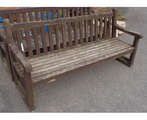 A slatted wood garden bench - length 5' 10"