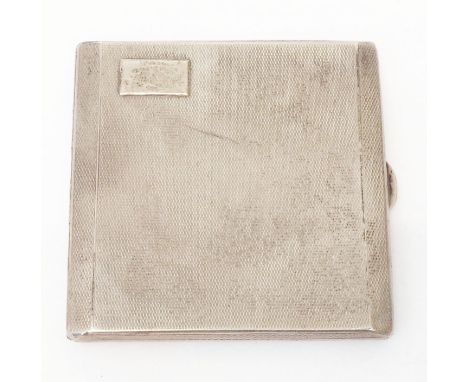 A silver cigarette case with engine turned decoration and blank cartouche