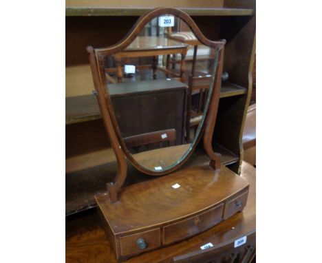 A 19th Century mahogany and strung Hepplewhite style platform dressing table mirror, with shield shaped plate and three drawe