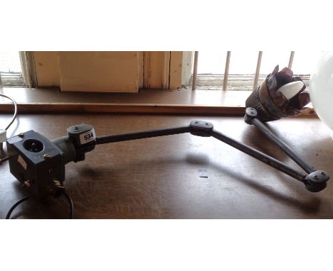 An industrial engineering desk lamp with later adapted shade
