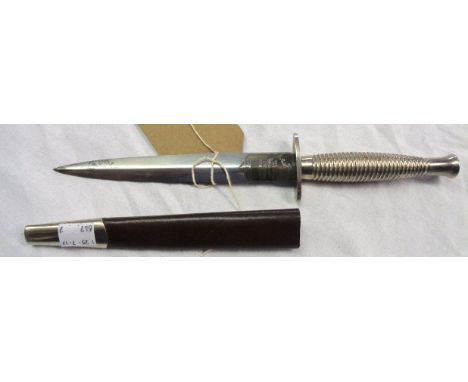 A Postwar 3rd Pattern Commando dagger with nickel grip and polished blade etched 'Wilkinson Sword Made in England', in associ