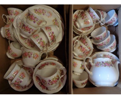 Two boxes containing a floral decorated Colclough tea and dinner service