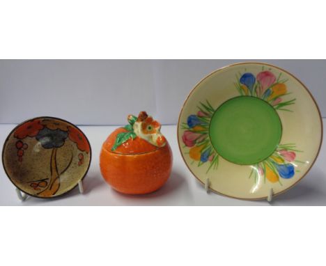 A Clarice Cliff cafe au lait style pin dish, Crocus pattern saucer, and Bizarre orange pattern marmalade pot and cover